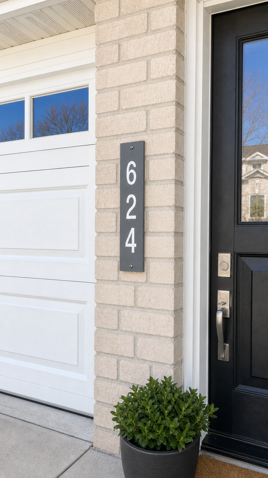 GRATTICA house number sign installed on a home